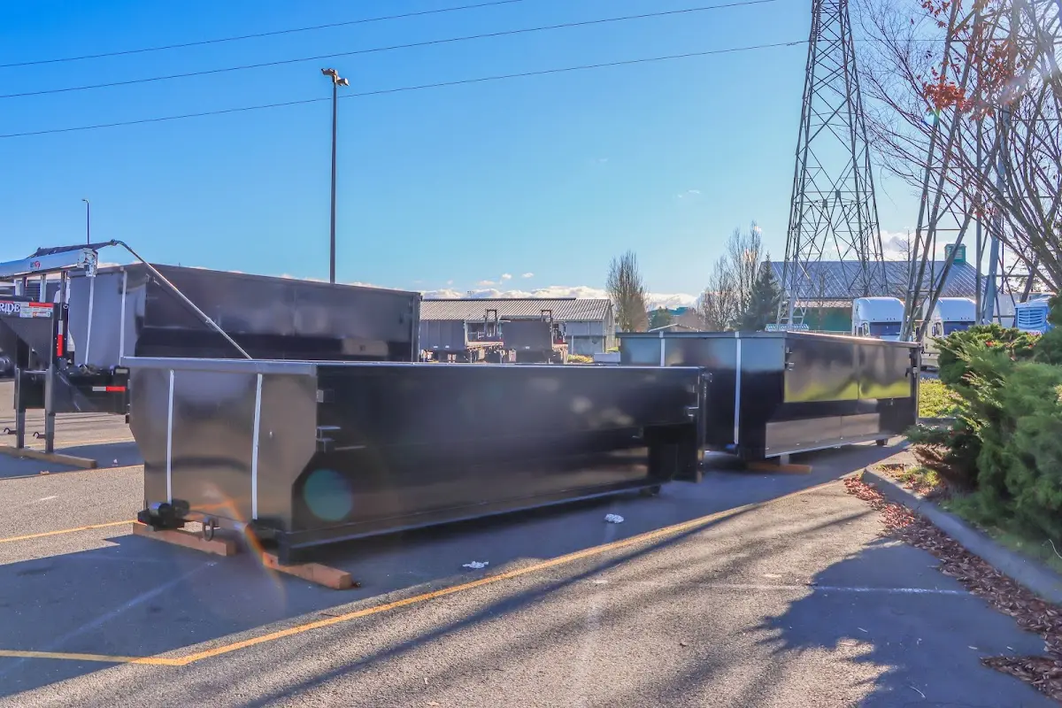 Roll-off dumpster ready for waste disposal at job site for Concrete Dumpster Rental in Inverness